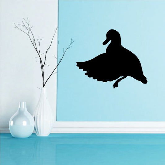 Black duck wall decal silhouette on blue wall