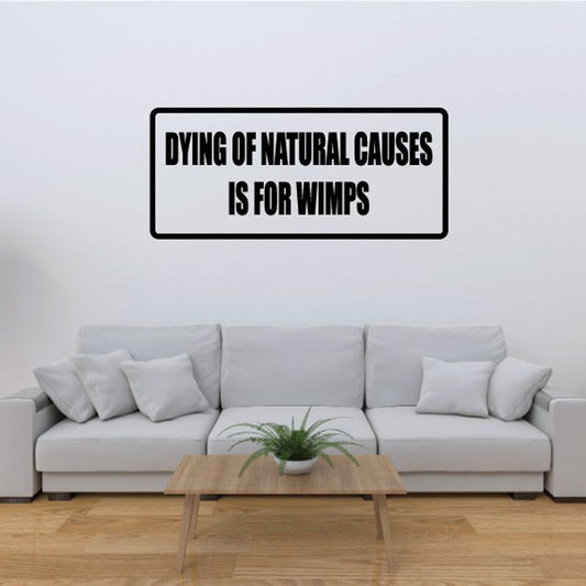 Rectangular wall decal with bold black text: “Dying of natural causes is for wimps”