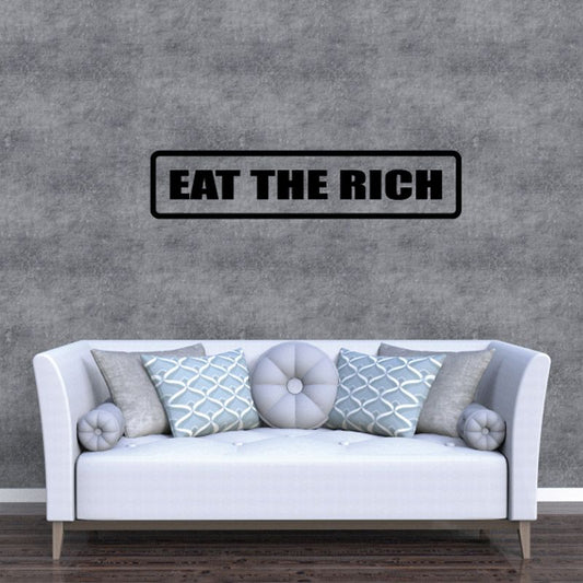 Black "Eat the rich" wall decal in a rectangular outline