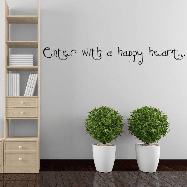 Wall decal with cursive text: “Enter with a happy heart”