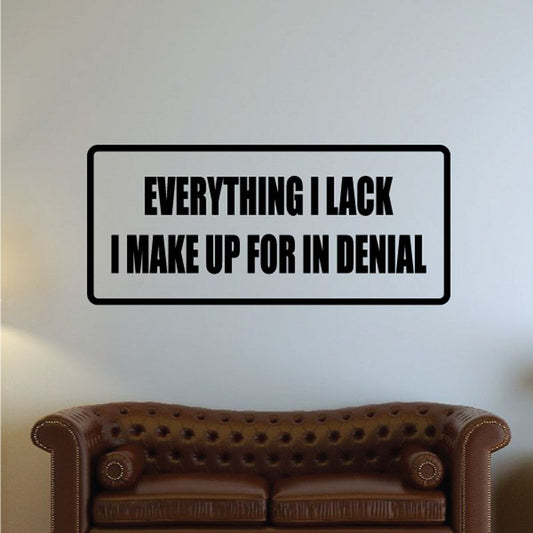Black-framed wall decal with white quote: EVERYTHING I LACK I MAKE UP FOR IN DENIAL
