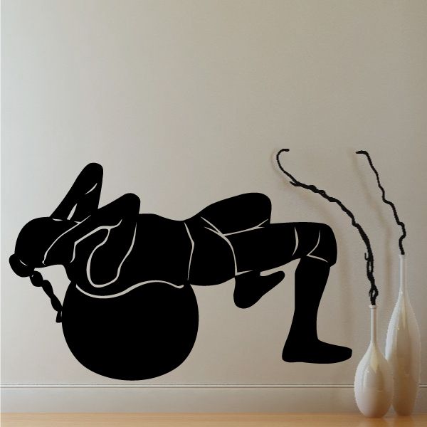 Black vinyl fitness wall decal with an abstract arm-and-ball workout graphic