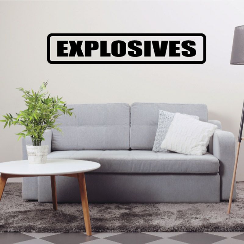 Black and white EXPLOSIVES wall decal in bold lettering.