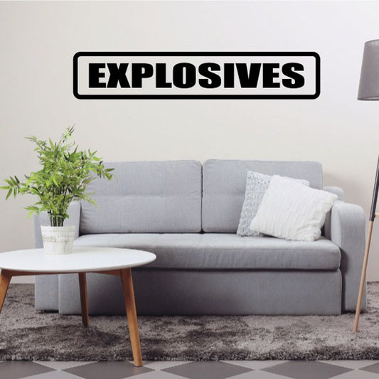 Black and white EXPLOSIVES wall decal in bold lettering.