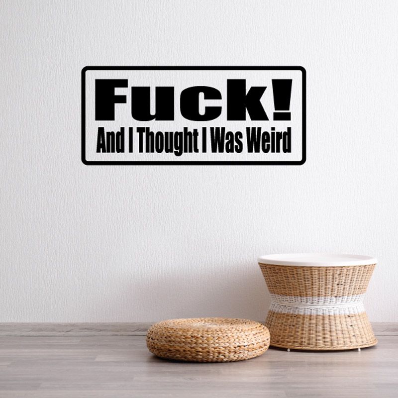 Black rectangular wall decal: 'Fuck! And I Thought I Was Weird'.