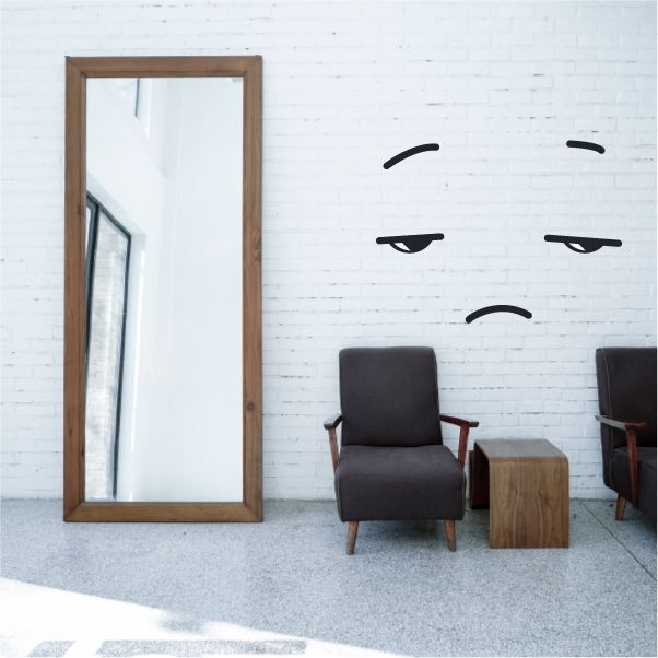 Winking face wall vinyl decal, black line art with one eye and smirk.