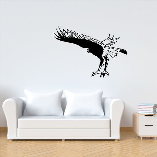 Falcon catching decal of black bird with wings spread, white outline