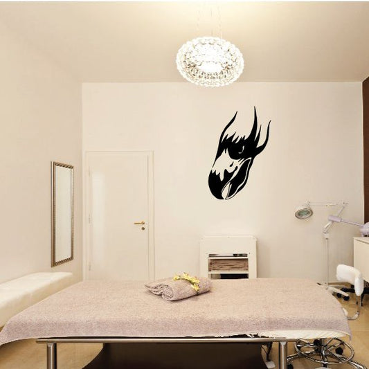 Black falcon head wall decal with sharp beak and feather silhouette