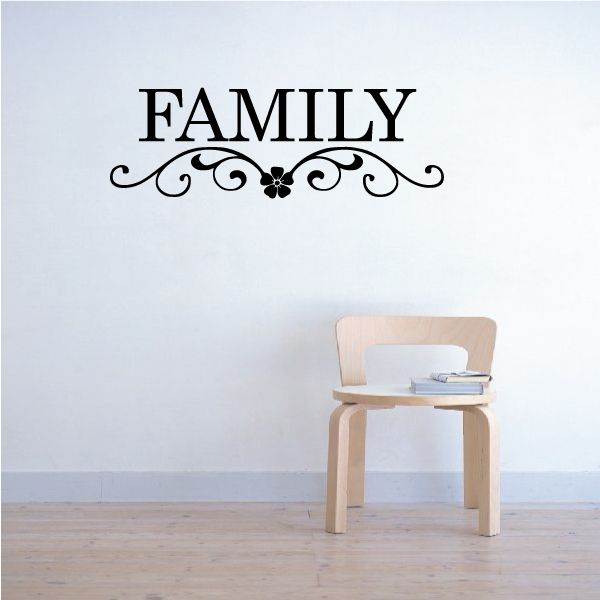 Wall decal with "FAMILY" text and black floral scrollwork with butterfly