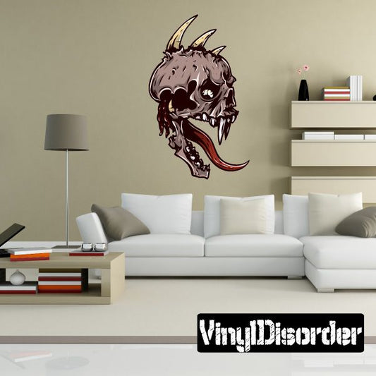 Fanged skull sticker with dark purple skull, open mouth, red tongue, horns