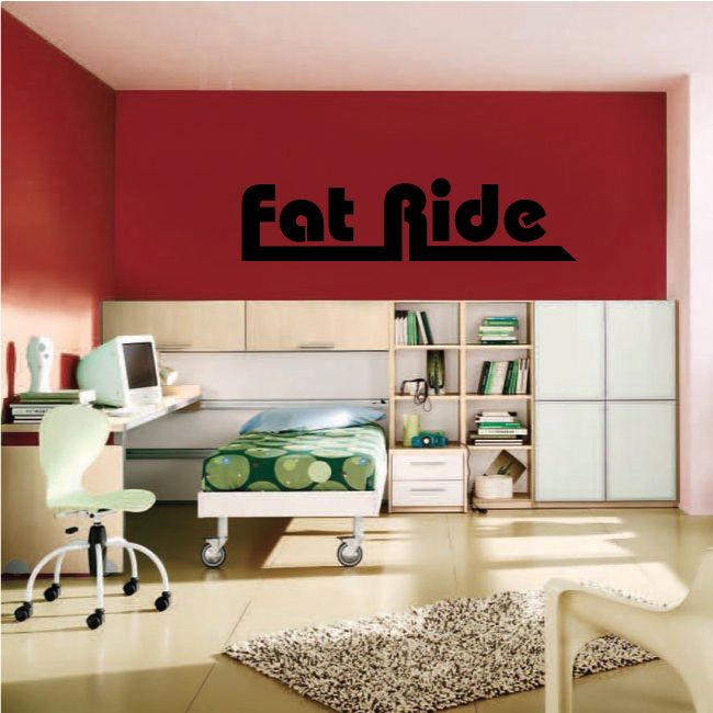 Fat Ride decal with bold black text on a red wall