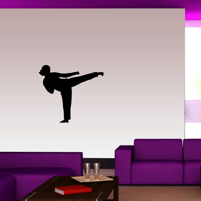 Female karate side kick wall decal with black silhouette of a woman kicking sideways
