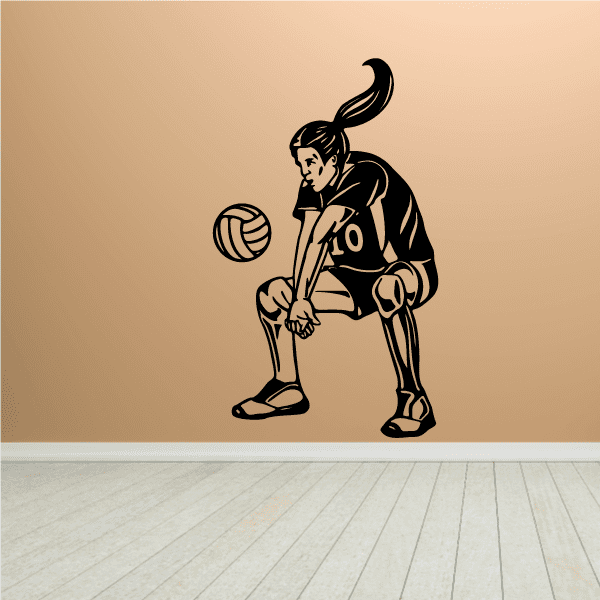 Female volleyball hitter decal of a player kneeling with a volleyball