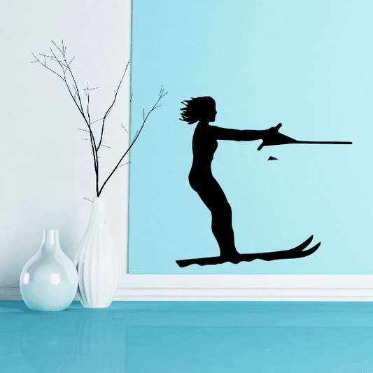 Black silhouette water skier decal, holding handle and gliding on skis.