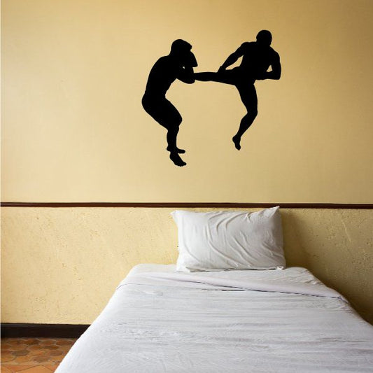 Vinyl wall decal showing two fighting silhouettes in black