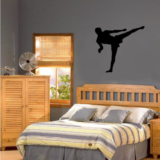 Martial arts fighting wall decal, black vinyl silhouette of a person kicking