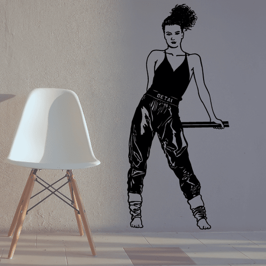 Black fitness wall decal of an athlete in a squat workout pose, arms extended