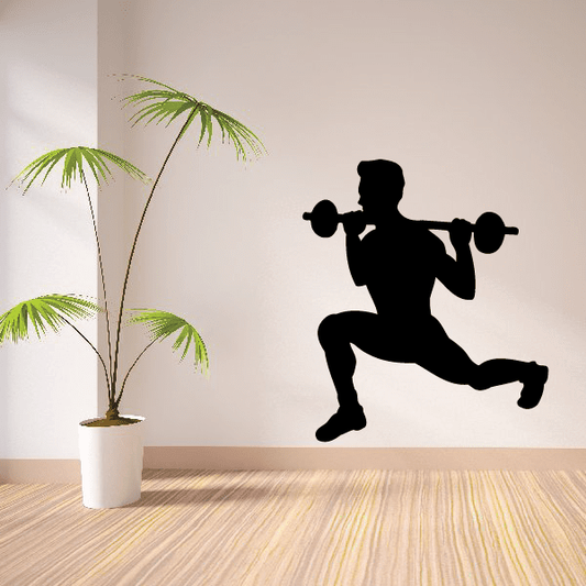 Black silhouette fitness wall decal of weightlifter holding dumbbells mid-lunge