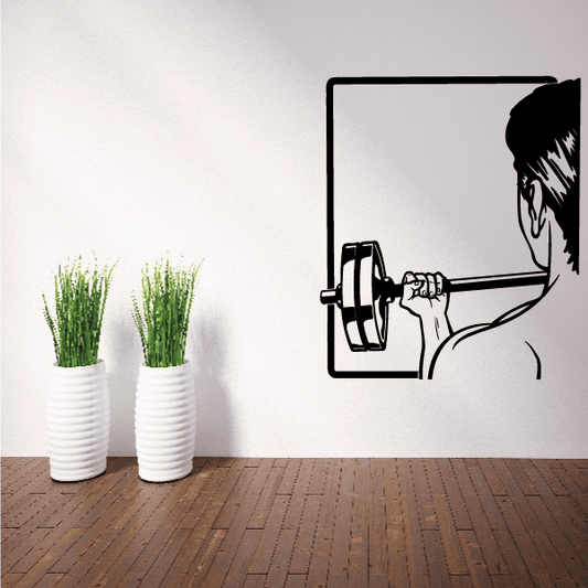 Black fitness wall decal of a person lifting weights in bold outline style