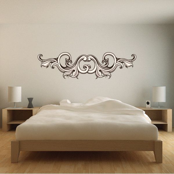 Ornate black floral headboard wall decal with scrolling vine design
