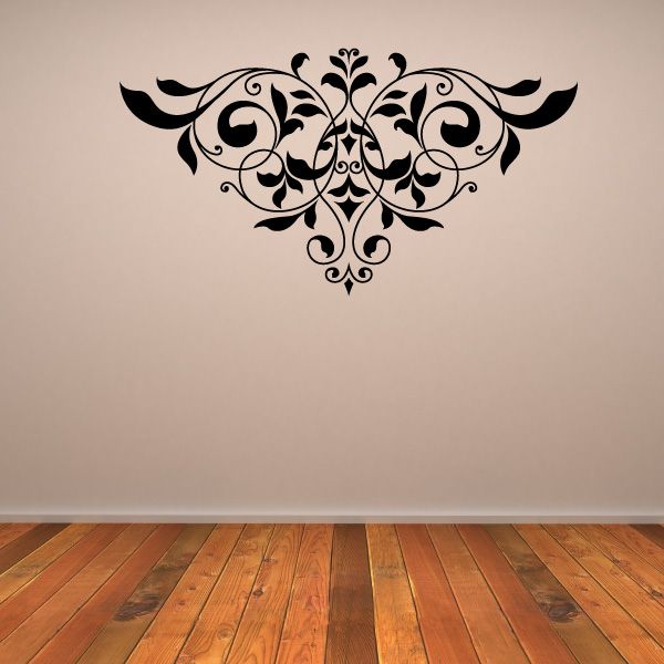 Ornate black floral wall decal with symmetrical scrollwork centerpiece