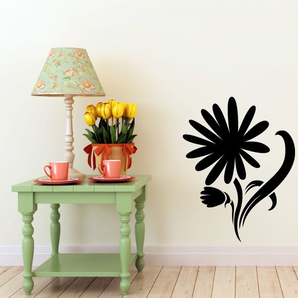 Black flower vinyl wall decal with looping stem and leaf accents