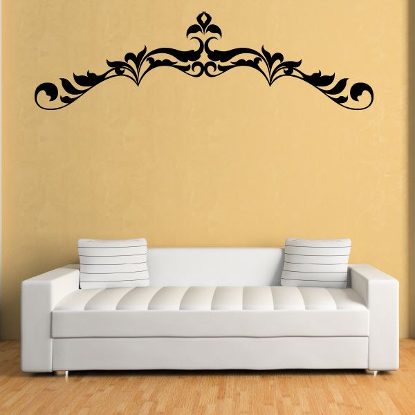 Ornate black vinyl wall decal with symmetrical scroll and fleur-de-lis motif