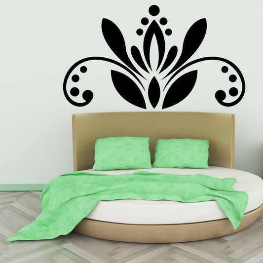 Ornamental floral mandala wall decal with black petals and curling scroll accents