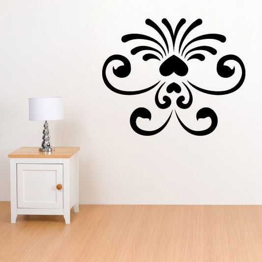 Ornate black fleur-de-lis style wall decal with scrolling flourishes and central flower
