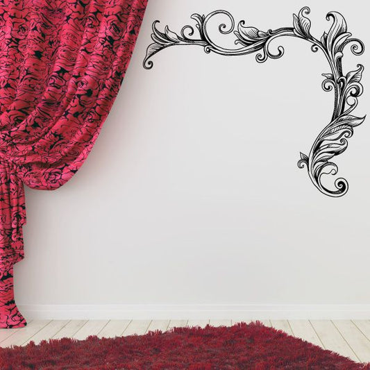 Ornate vinyl corner flourish wall decal with black scrollwork on white