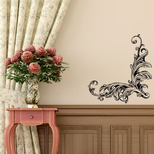 Ornate black vinyl wall decal with scrolling floral corner design