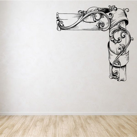 Ornamental vinyl wall decal with floral scroll corner design, arched ribbon and leaves