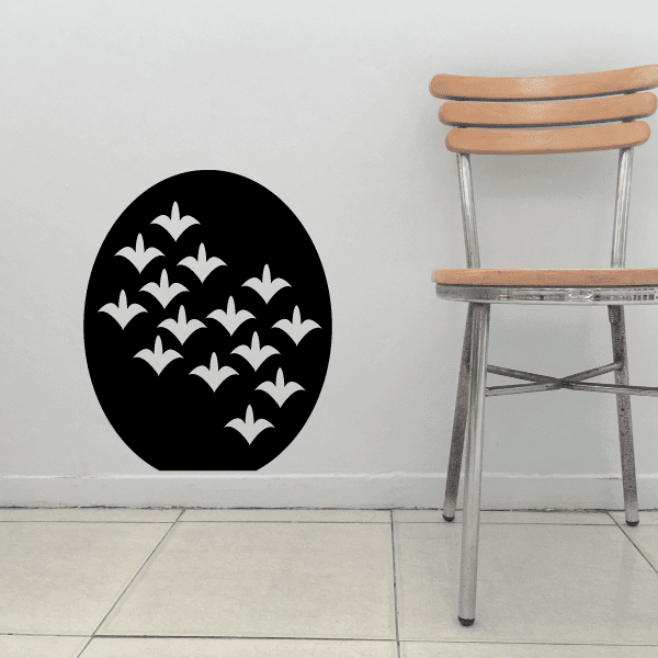 Wall decal with a black circular design and white floral motifs