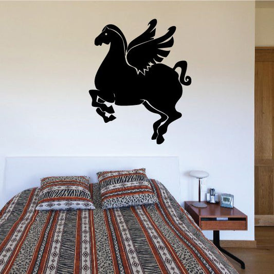 Flying pegasus silhouette decal in black, stylized winged horse shape