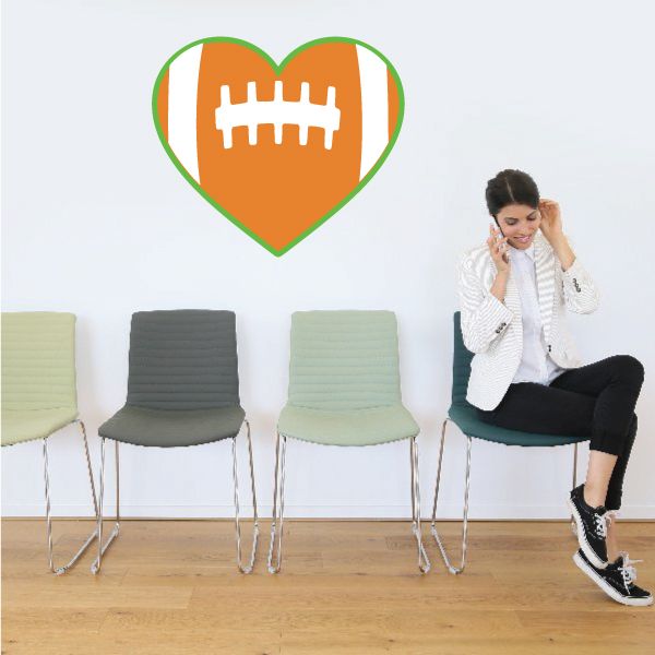 Heart-shaped football sticker: orange heart with green border and white football