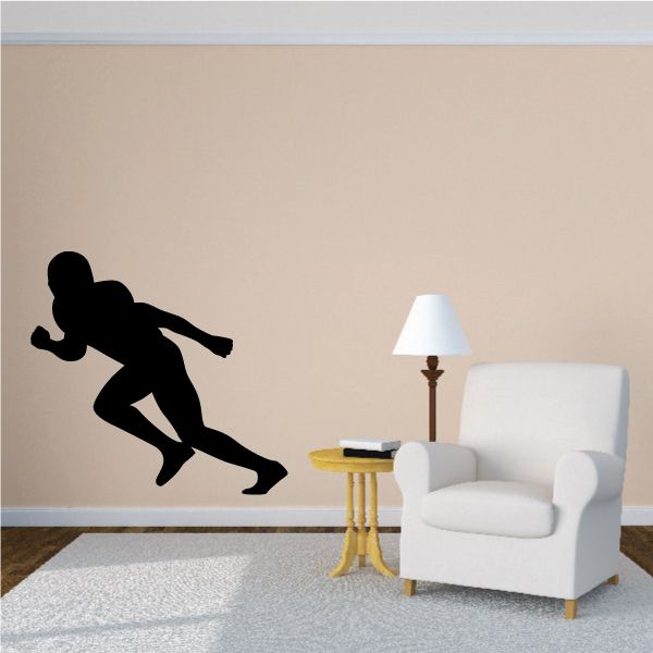Football player wall decal, black vinyl silhouette of an action pose kick