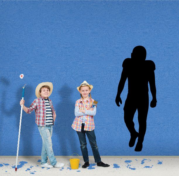 Football player wall decal with black vinyl silhouette of a running football player