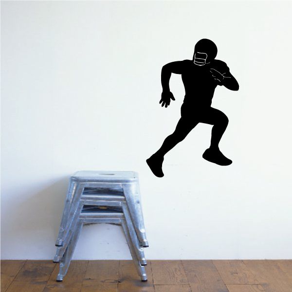 Football wall decal of black American football player running silhouette
