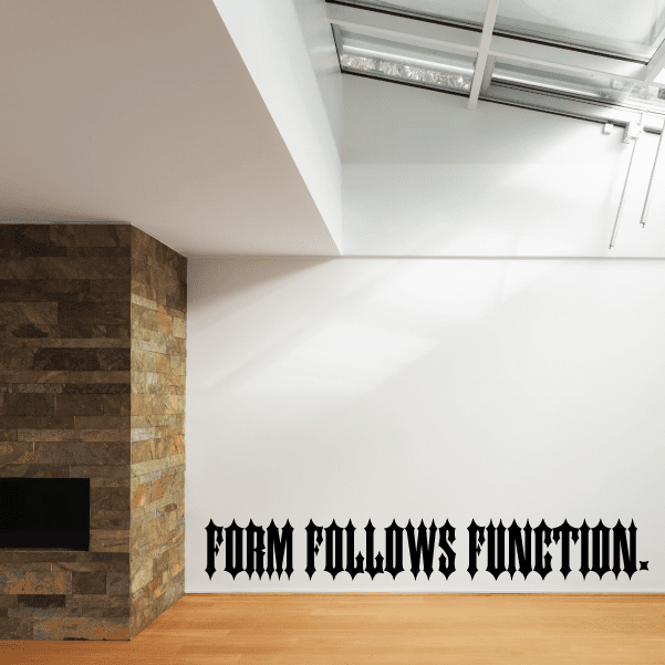 Wall quote mural decal with black text: "FORM FOLLOWS FUNCTION" on wall edge