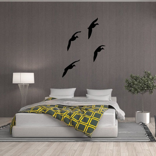 Angled flying duck wall decal, four black duck silhouettes on a wall