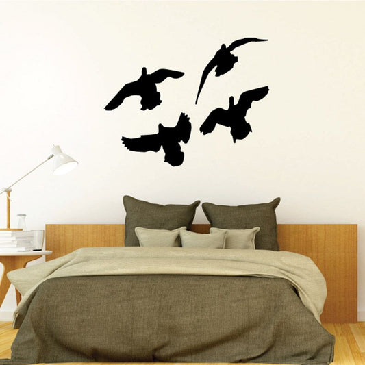 Flying ducks wall decal with four black bird silhouettes
