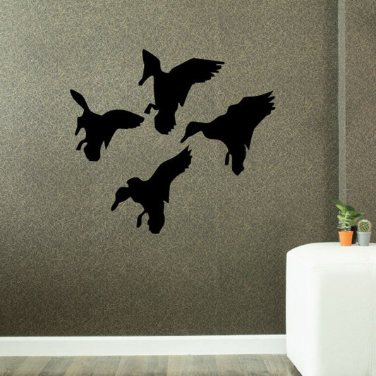 Landing duck wall decal set with four black duck silhouettes in flight