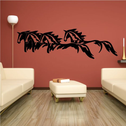 Four horses running decal, black silhouette across a wall