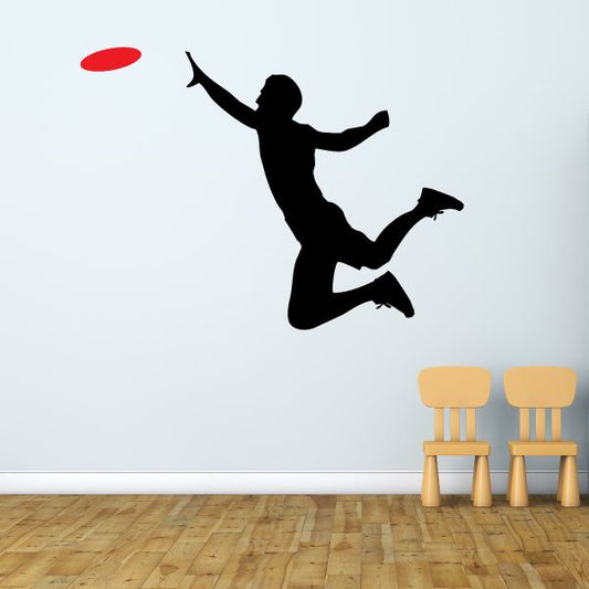 Frisbee catch decal: black silhouette catching a red frisbee on a wall