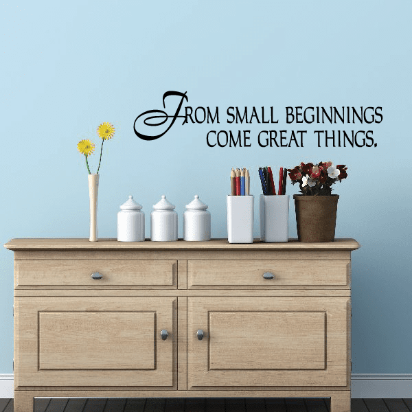 Wall decal with black script quote: From small beginnings come great things.