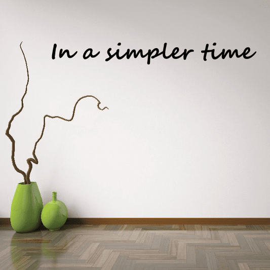 Cursive wall decal text 'In a simpler time' with vine outline
