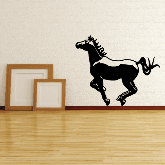 Galloping pony decal, black silhouette of a horse mid-gallop on a wall.