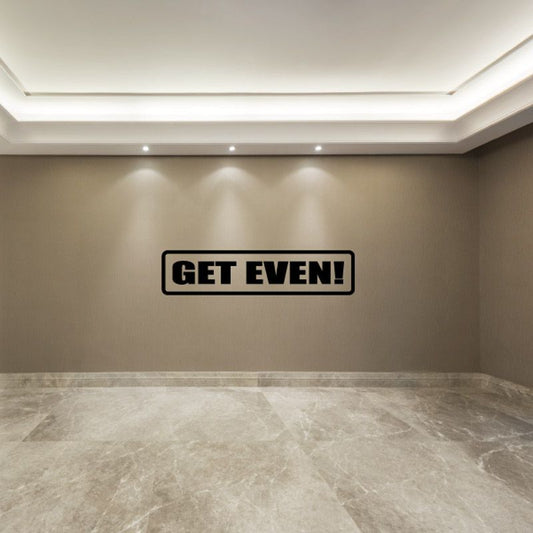Wall decal with black-outlined rectangle and bold “GET EVEN!” text