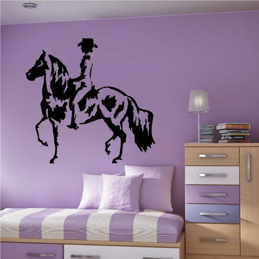 Girl riding horse wall decal with black silhouette and raised arm
