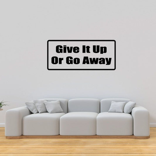 Black rectangular wall decal reading “Give It Up or Go Away”